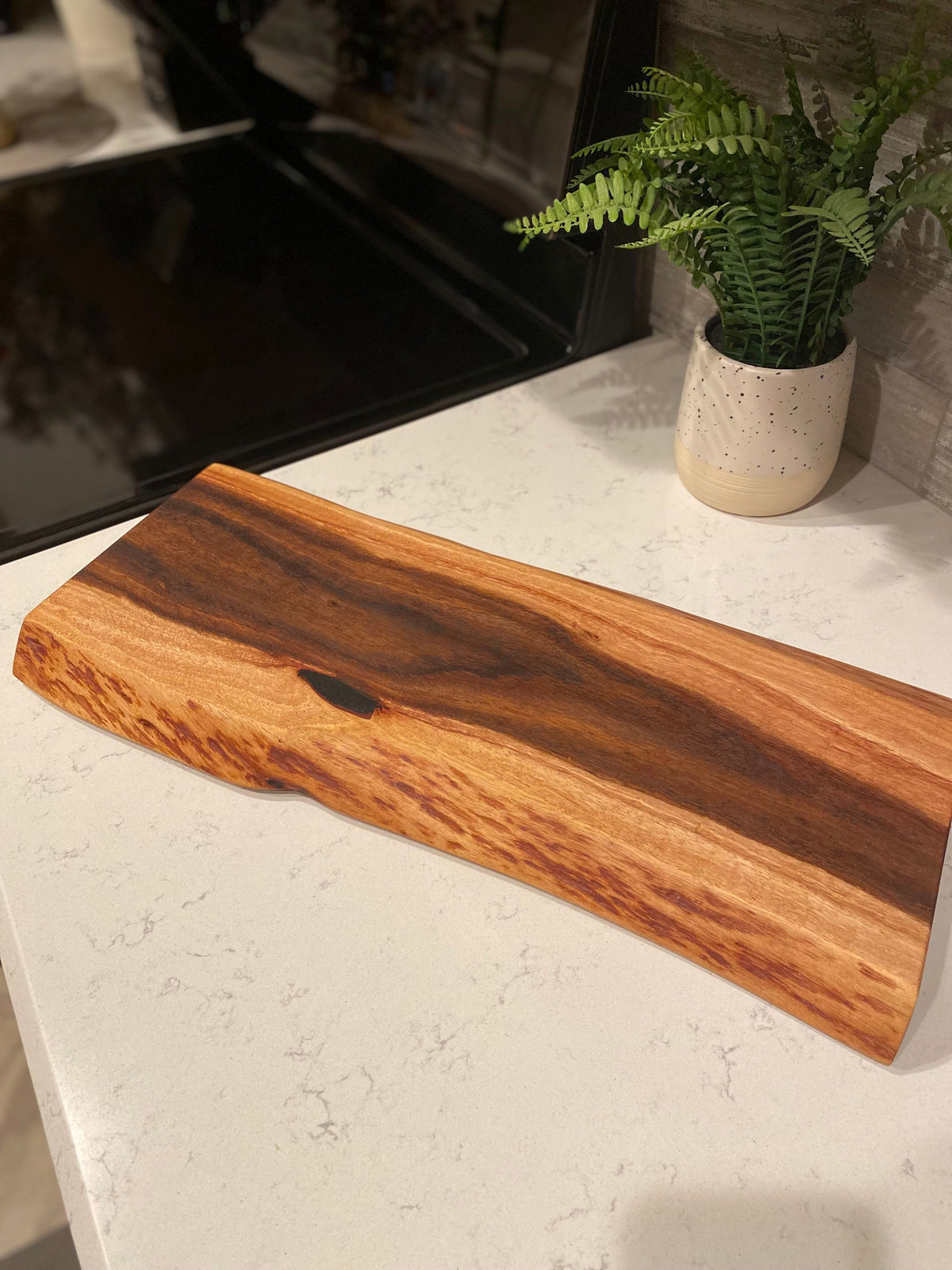 Large live edge wood charcuterie board with finger grip handles