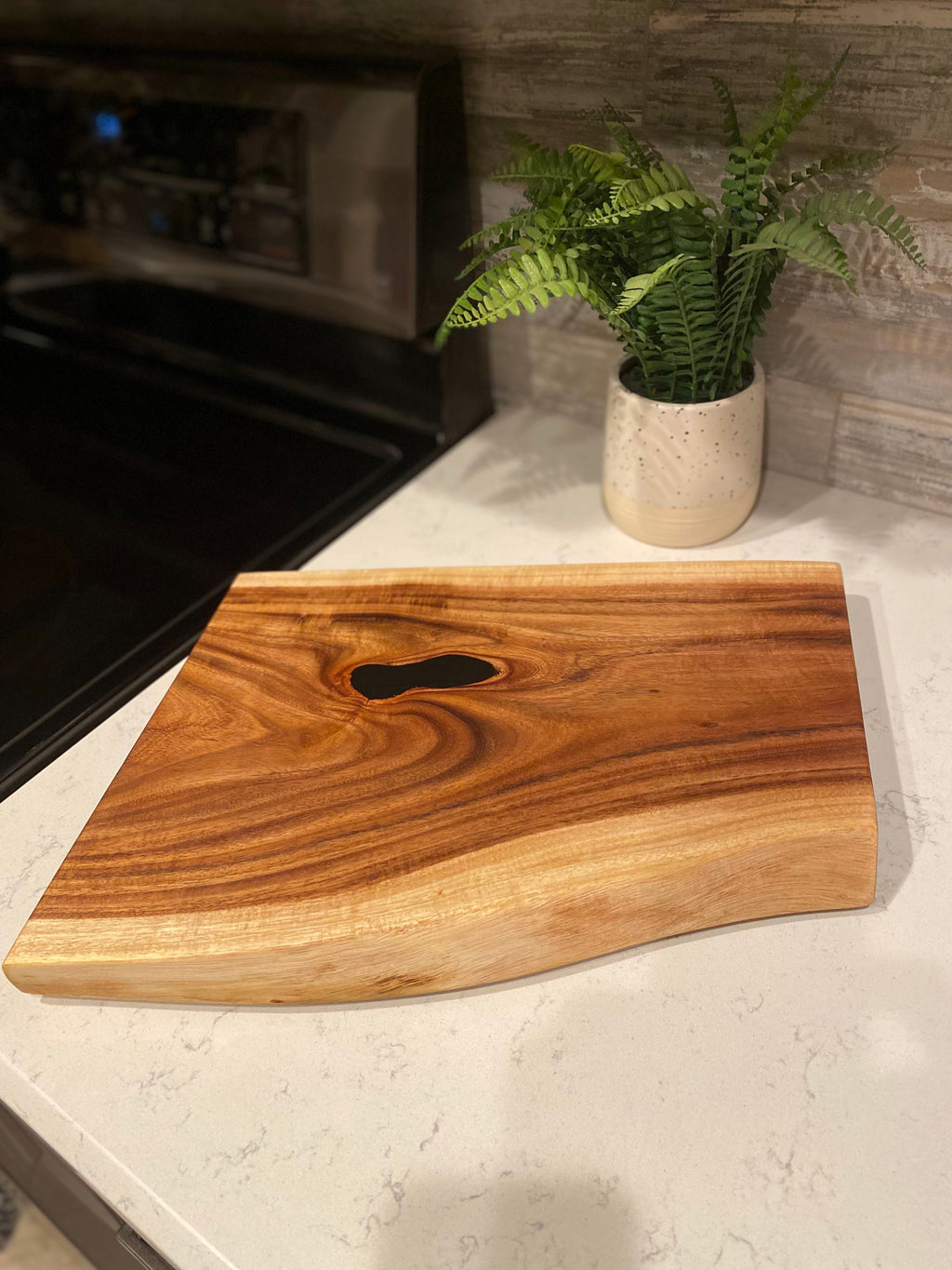 Small live edge wood charcuterie board with finger grip handles